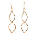 Boucles d'oreilles pendantes spirales | Dorées