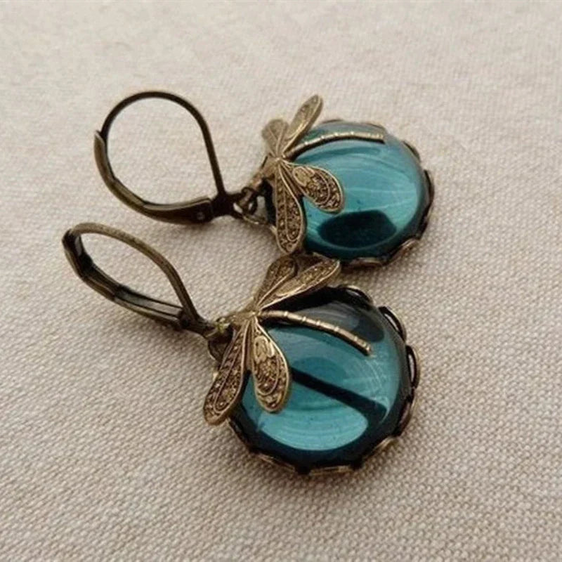 Pendientes de libélula esférica en color oro antiguo