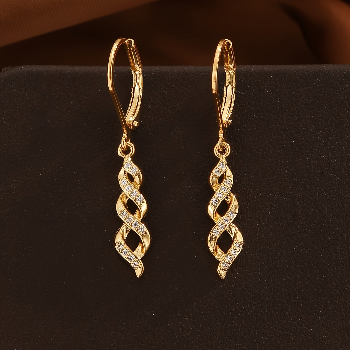 Ava | Pendientes Torsión Brillante Dorados