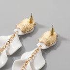 Boucles d'oreilles pendantes avec pétales d'orchidée